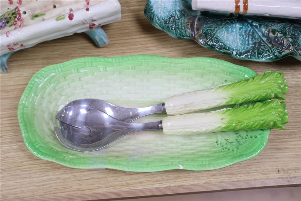A Majolica style asparagus stand, a dish, graduated rabbits, a celery dish, and two jelly moulds, largest width 40cm